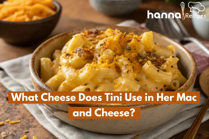 What cheese does Tini use in her mac and cheese? Homemade dish with melted sharp cheddar, mozzarella, and parmesan cheese in a rustic bowl.