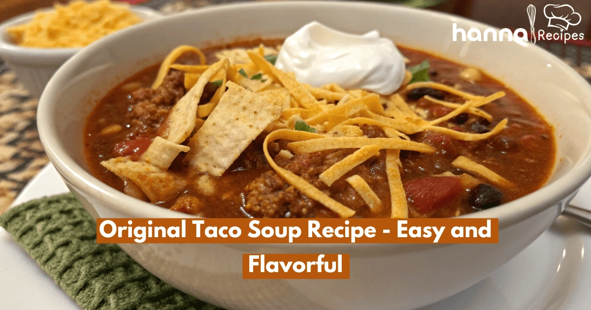 Close-up shot of a hearty bowl of original taco soup topped with melted cheese, sour cream, and crispy tortilla strips, showcasing vibrant colors and fresh ingredients.