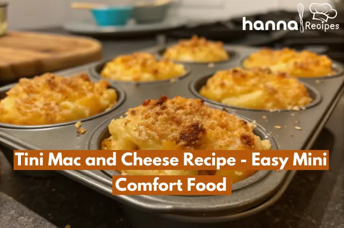 Homemade mini mac and cheese cups with golden crispy edges, creamy cheese, and bubbling texture, showcasing a close-up of the delicious comfort food. Baked to perfection in a muffin tin, the image highlights the mouthwatering details of the cheesy, golden topping and al dente pasta, captured in a casual, unfiltered style.